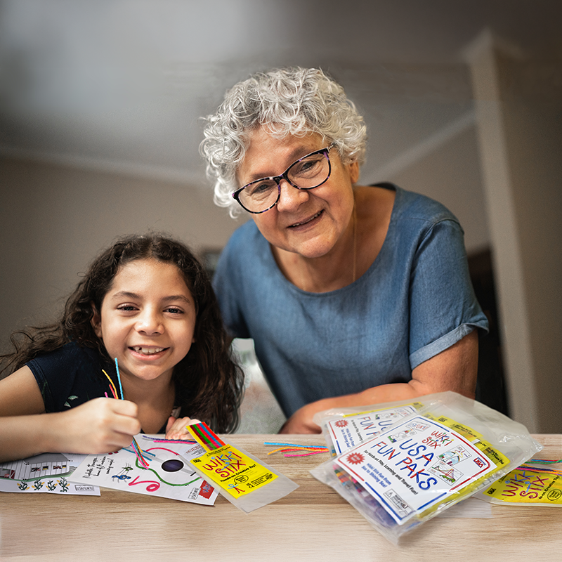 Grandmother and granddaughter playing with the USA Fun Paks!