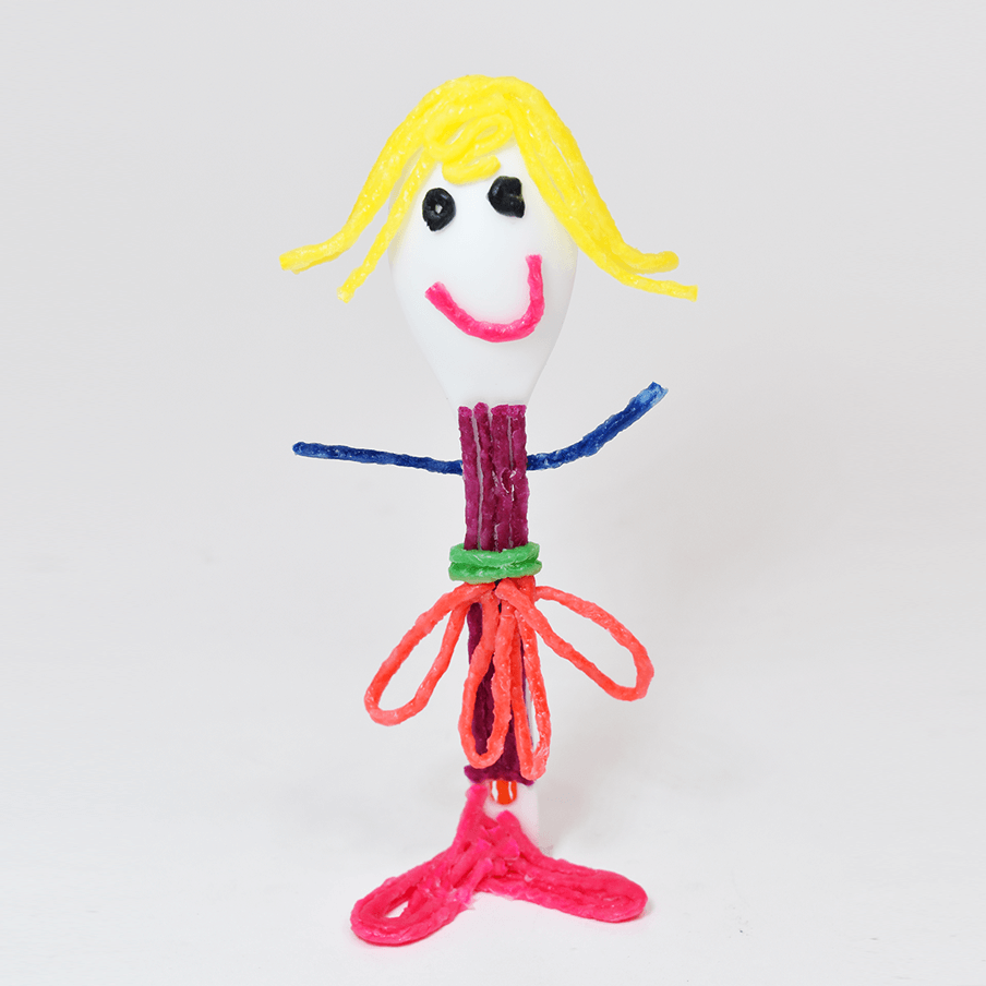 Simple girl with skirt on white spoon.