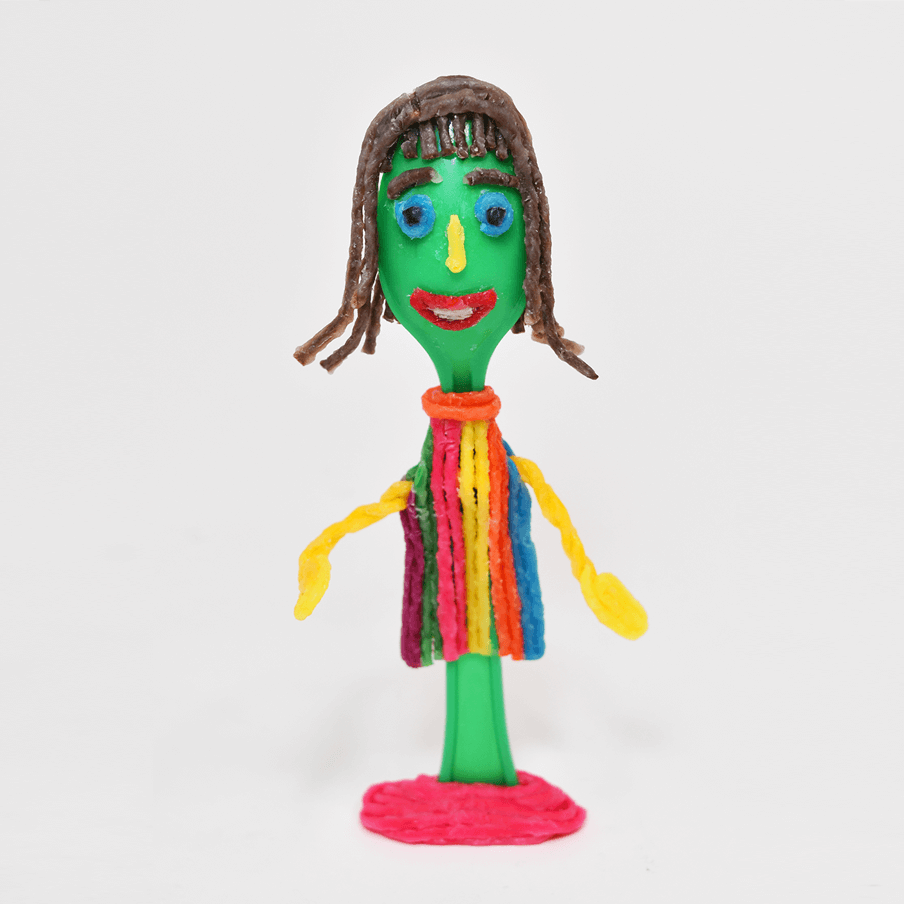 Green spoon with girl in striped dress.