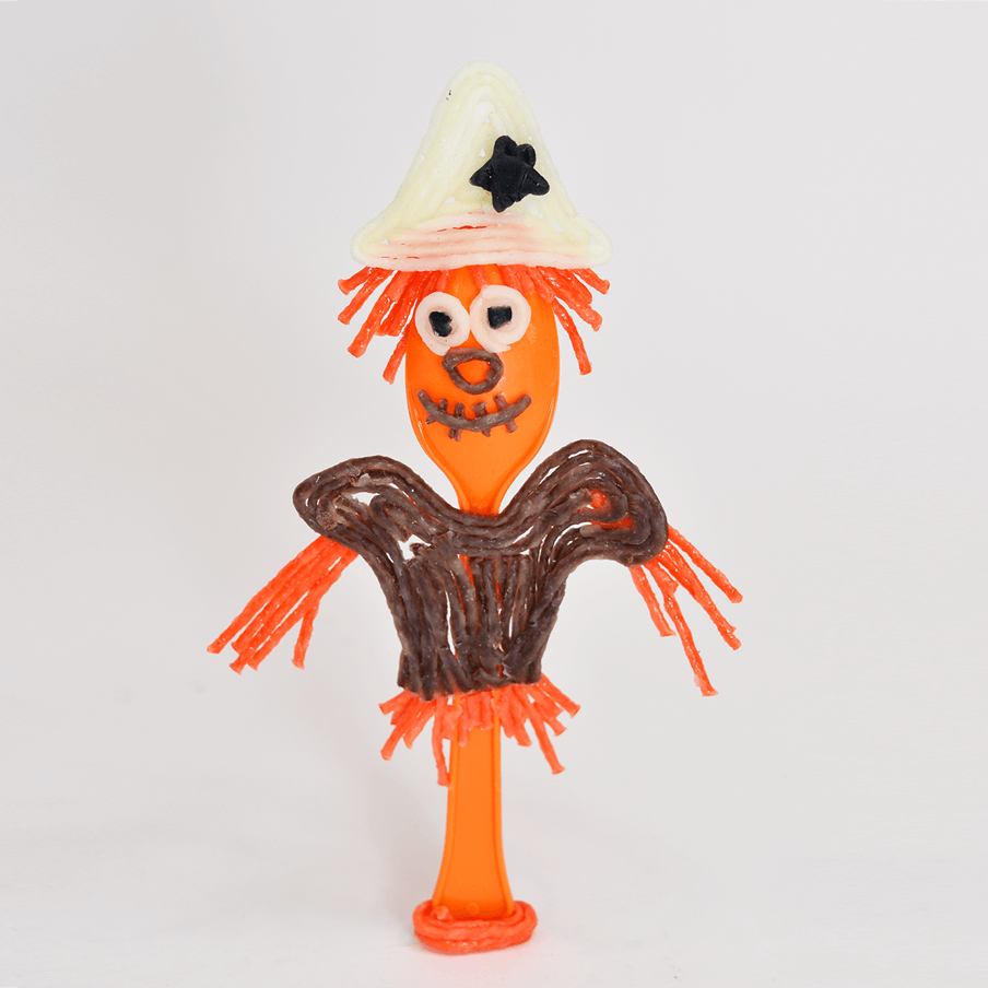 Orange spoon as scarecrow.