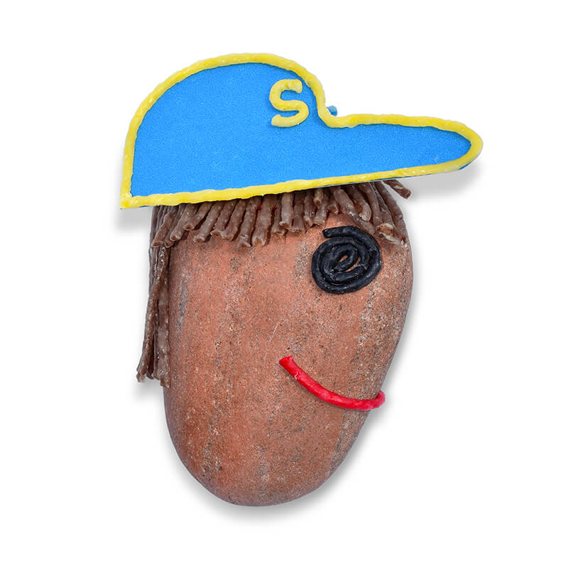 Rock decorated to look like a boy in a hat.