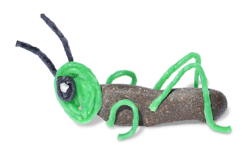 Rock decorated to be a Grasshopper.