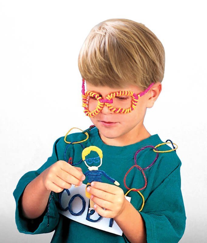 4-year-old boy in Wikki glasses and chain around his neck.