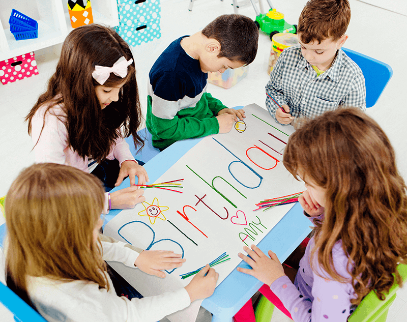 Kids at birthday party creating a Happy Birthday Banner!
