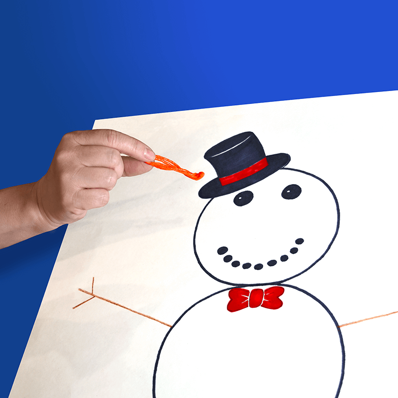 This image illustrates sticking the nose on the snowman.