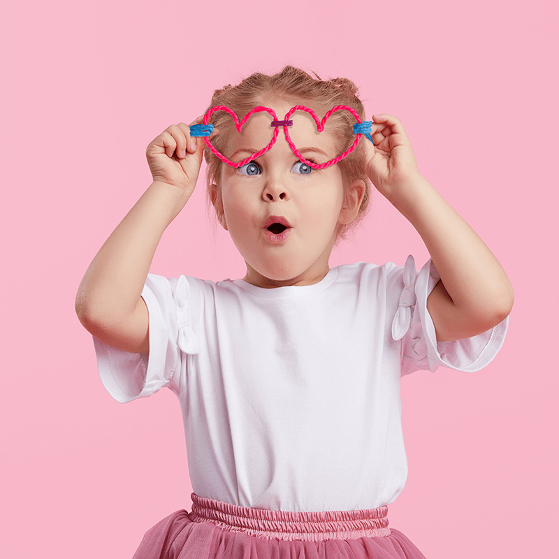 Adorable girl with heart-shaped Wikki Stix glasses!