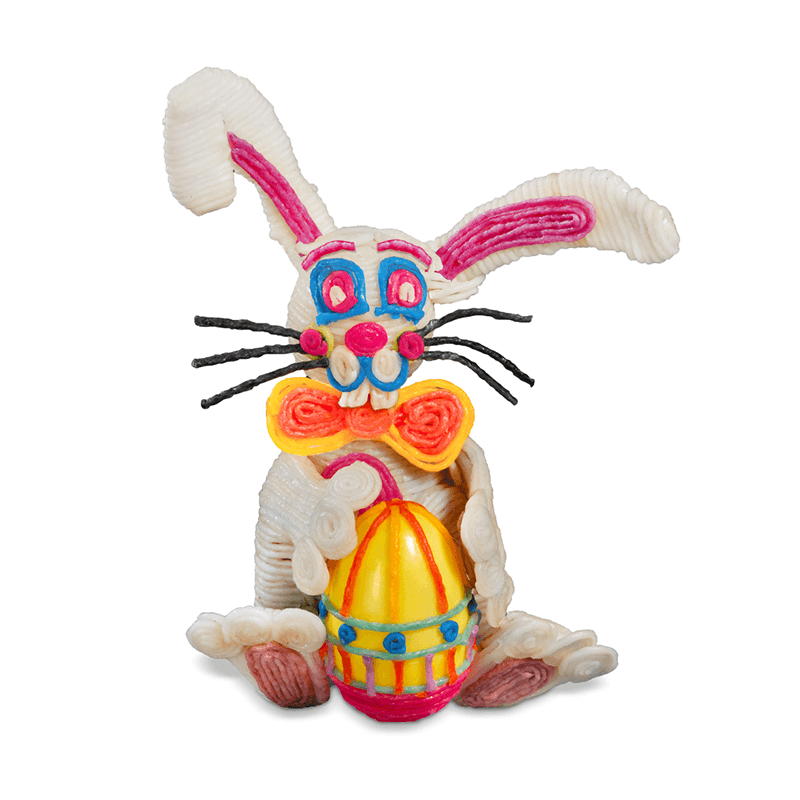 Intricate Wikki 3-D bunny holding and a plastic Easter egg decorated with Wikki Stix.