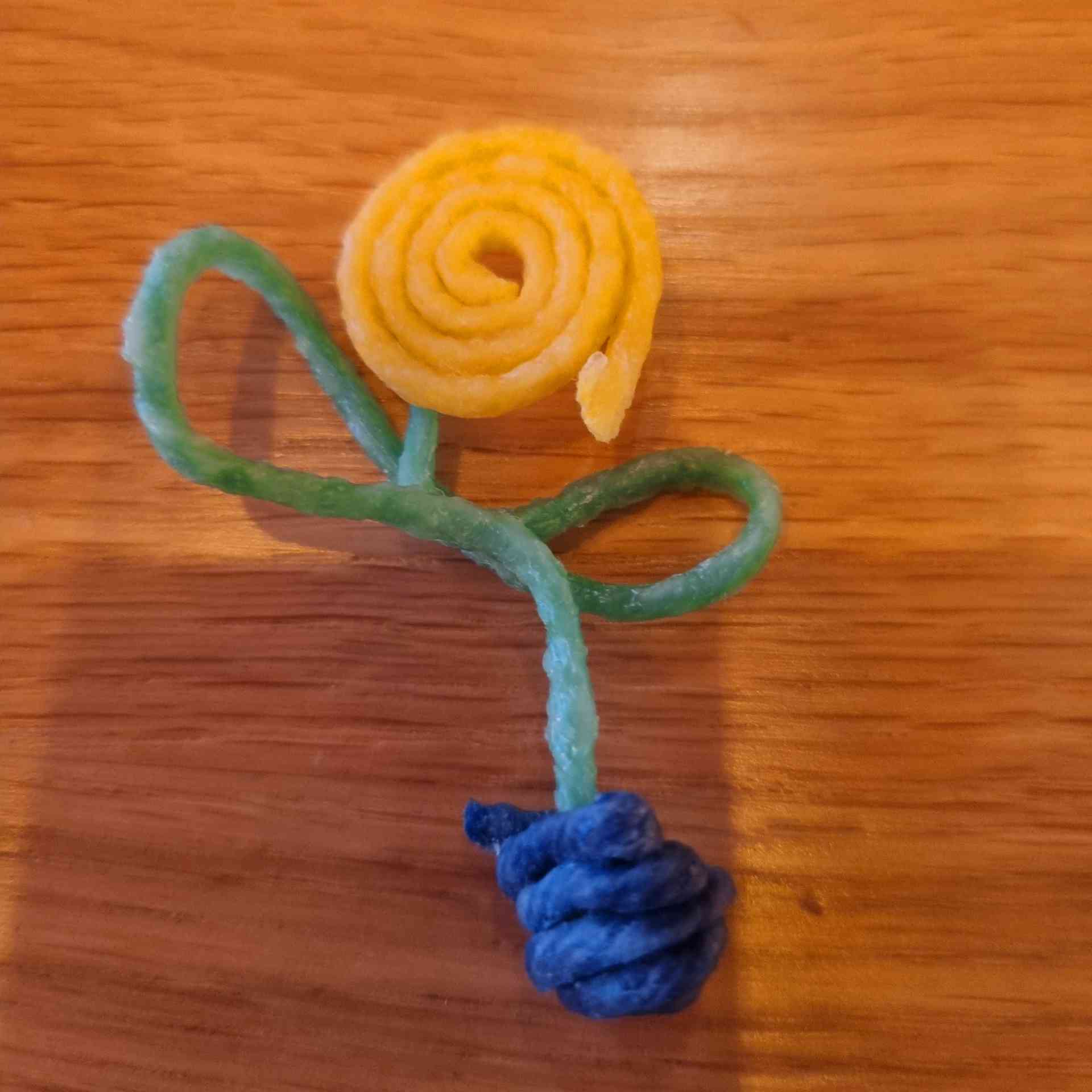Flower in a pot created with Wikki Stix.