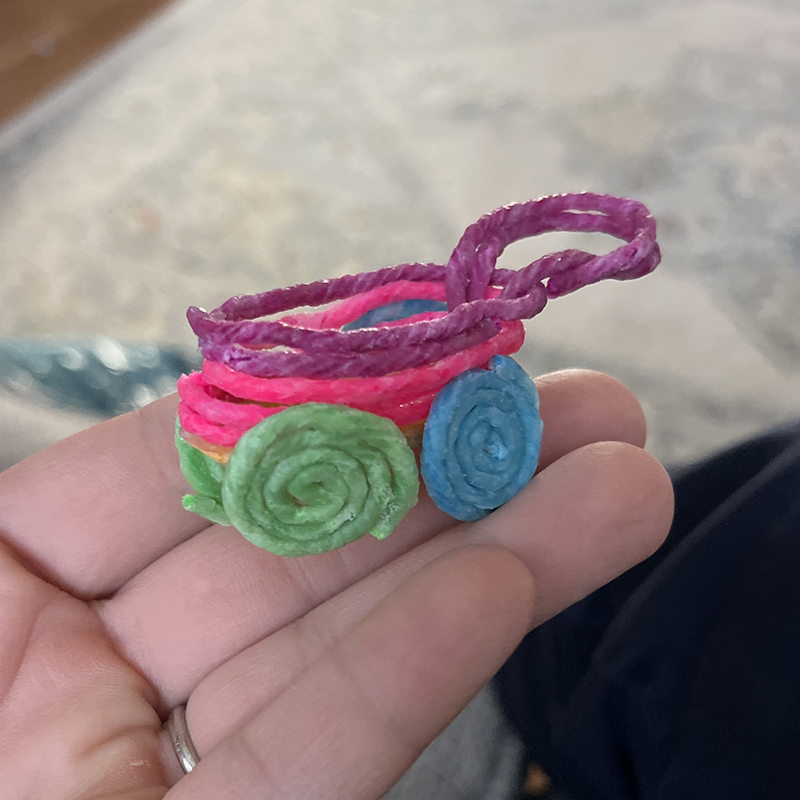 Colorful rainbow cart created with Wikki Stix.
