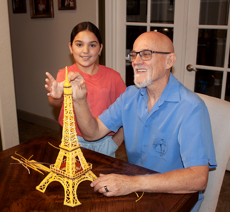 Grandfather and granddaughter admiring the Eiffel Tower created with Wikki Stix!