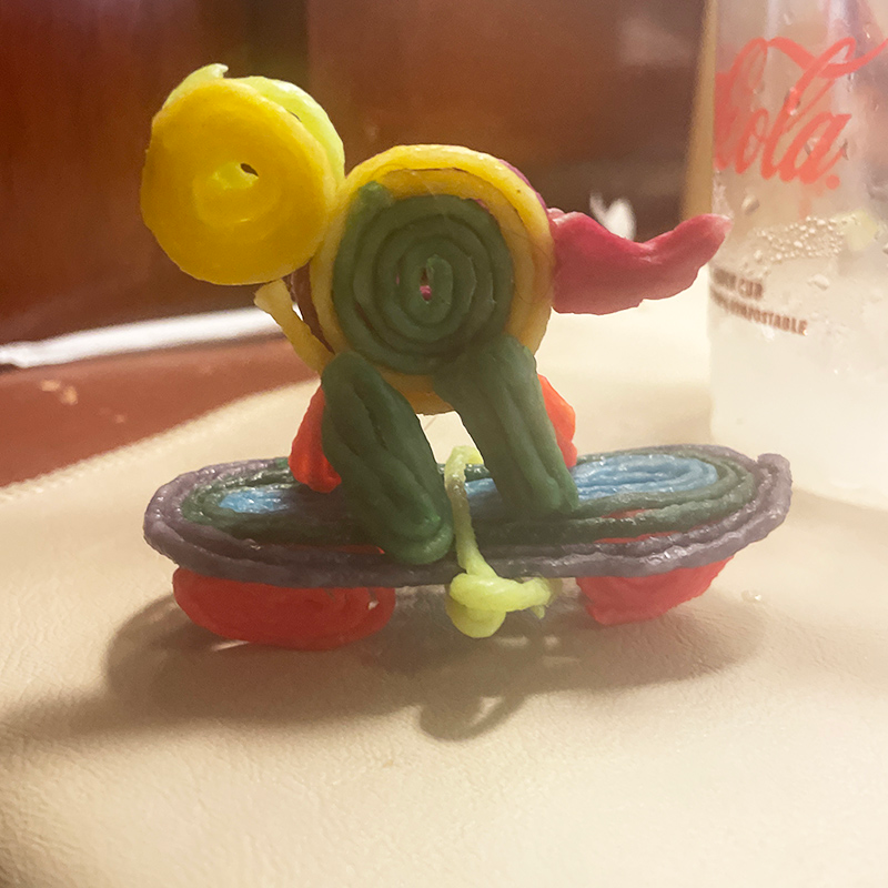 Turtle on a skateboard created with Wikki Stix.