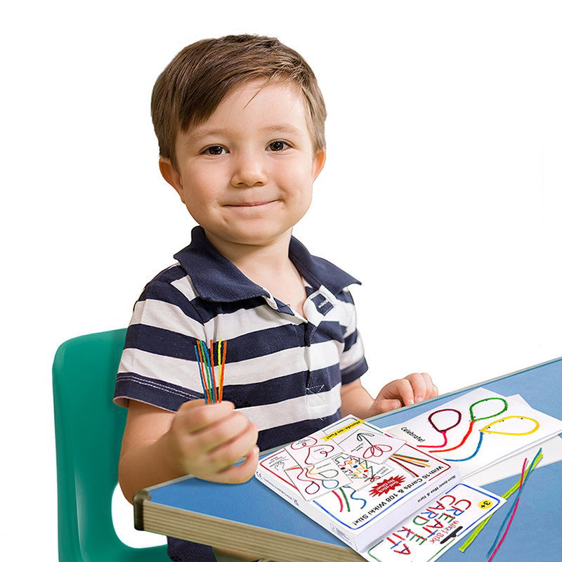 Boy creating cards with the Wikki Stix Create-A-Card Kit!