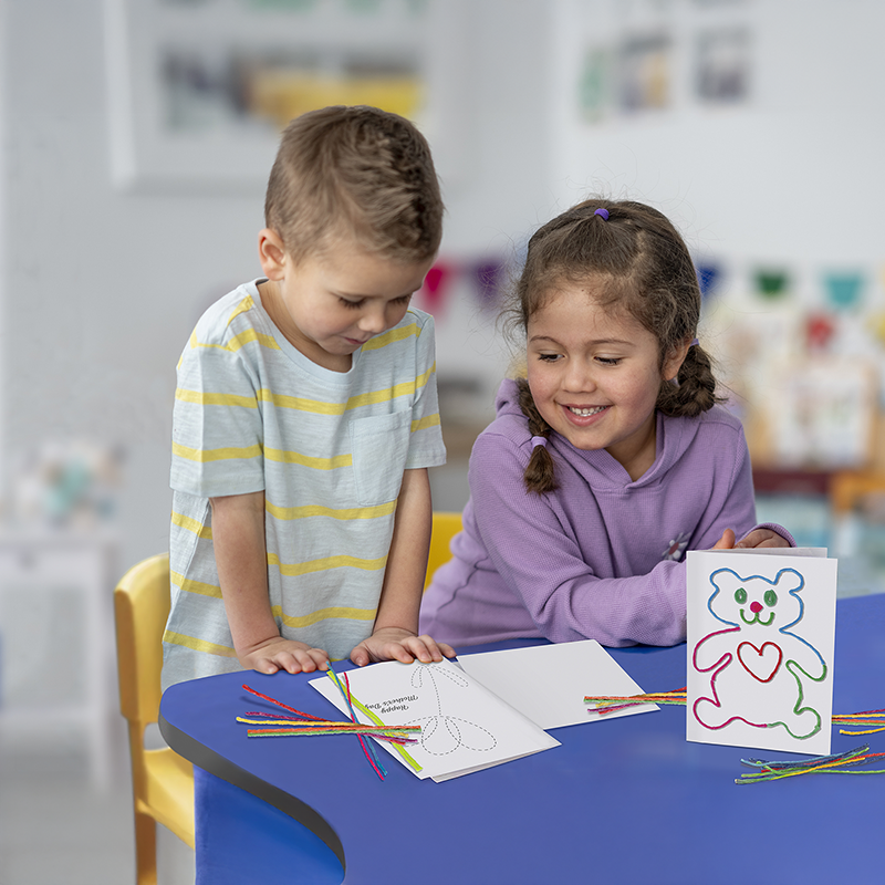 Kids creating cards with the Create A Card Kit.
