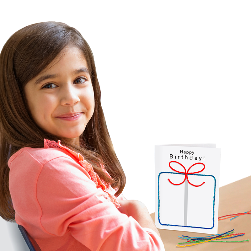 Adorable girl with the birthday card she created with the Wikki Stix Create-A-Card Kit!