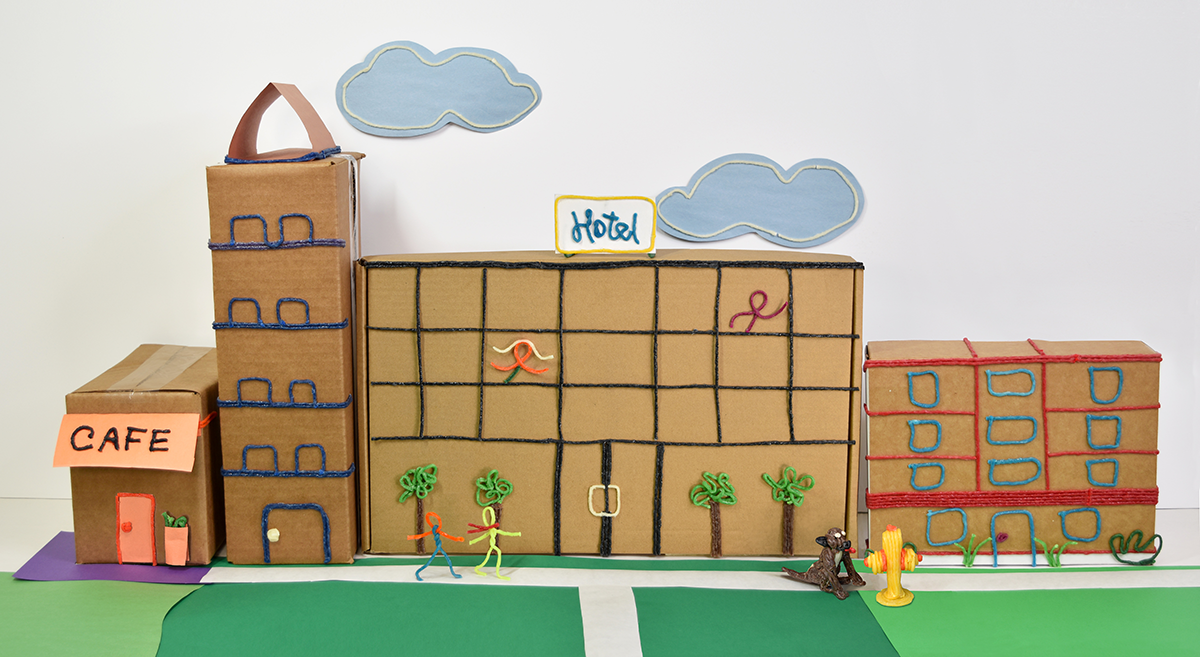 Cityscape created with cardboard boxes and Wikki Stix!