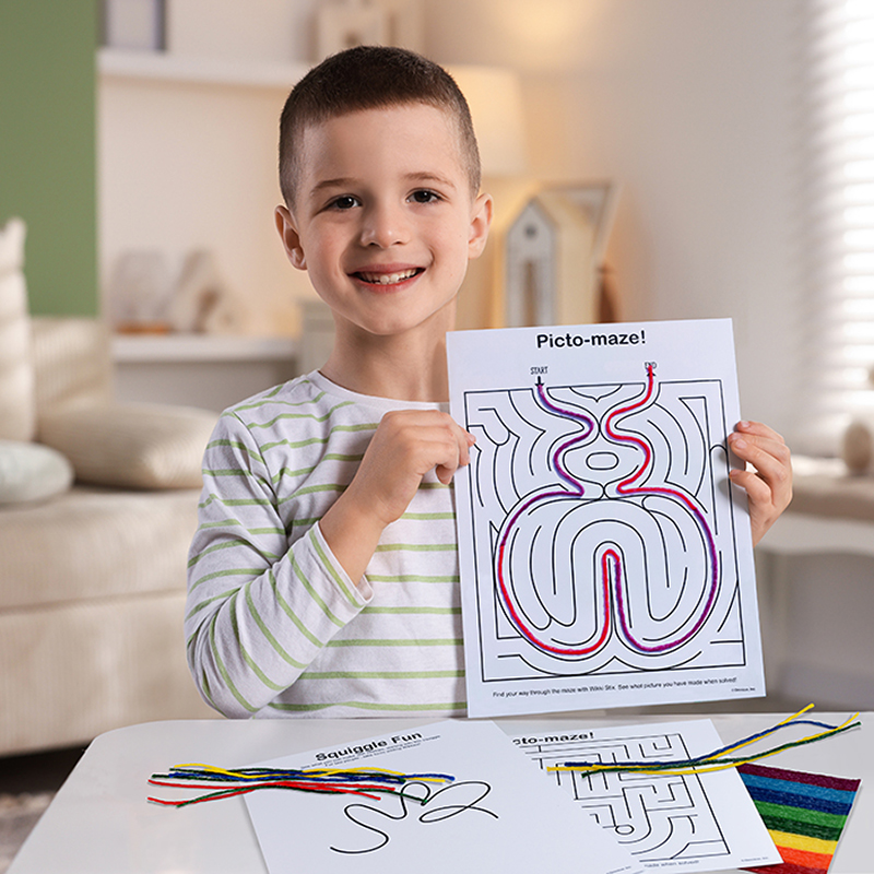 Boy Holding Game Time Fun Maze.
