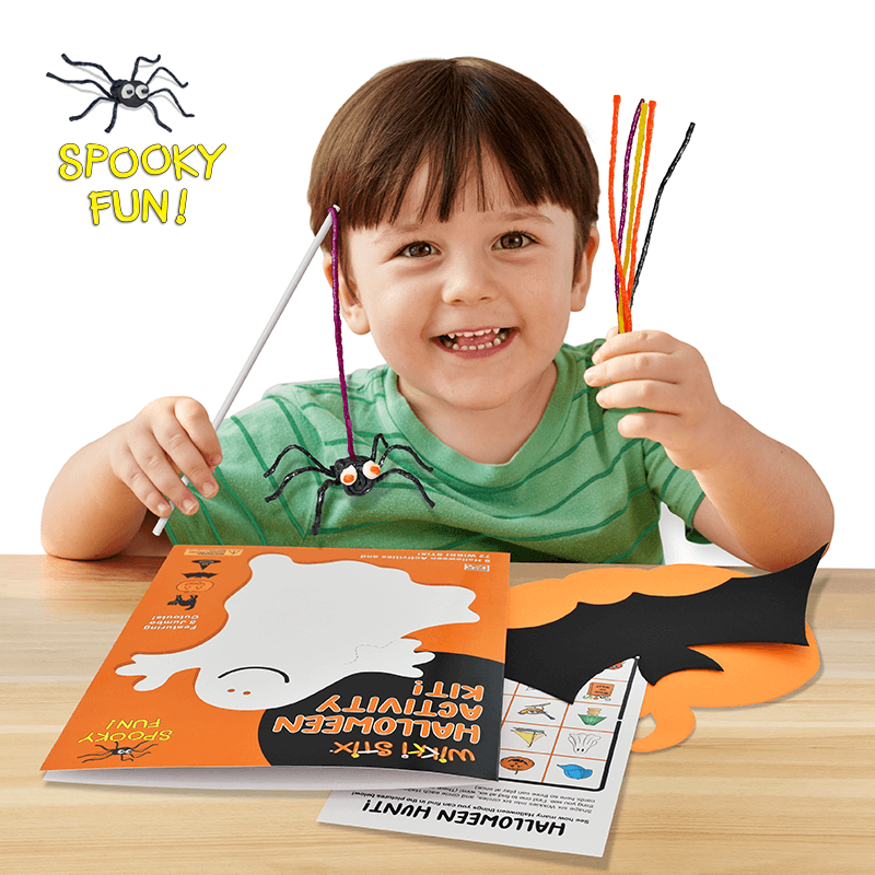 Halloween Activity Kit product display on a table with an adorable boy!